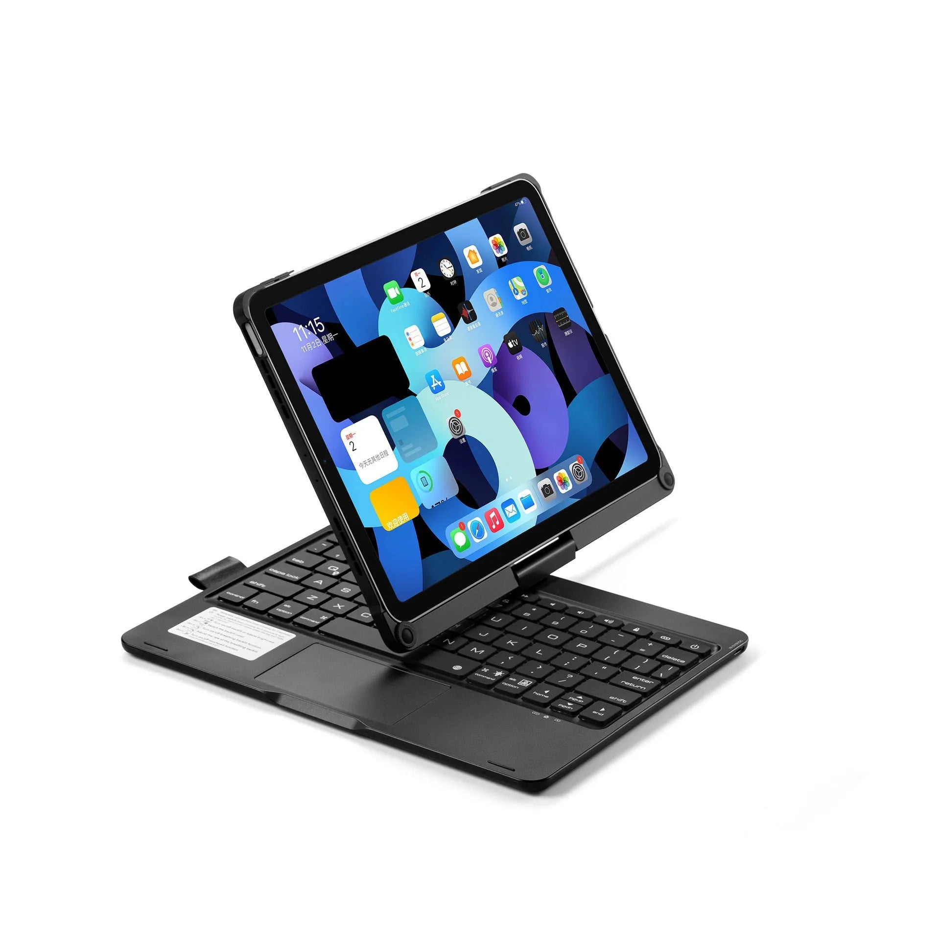Silver rotating Bluetooth keyboard with backlit keys next to an iPad Pro.
