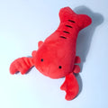 Red lobster-shaped squeaky dog toy for small to medium breeds