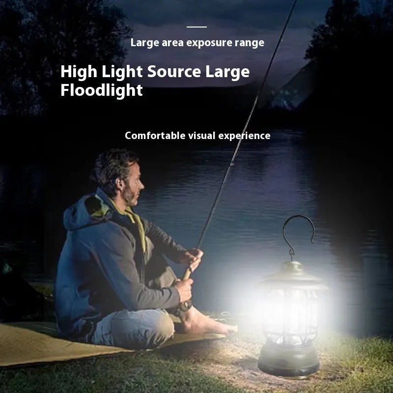 Dark green portable camping lantern with head lamp function on a table