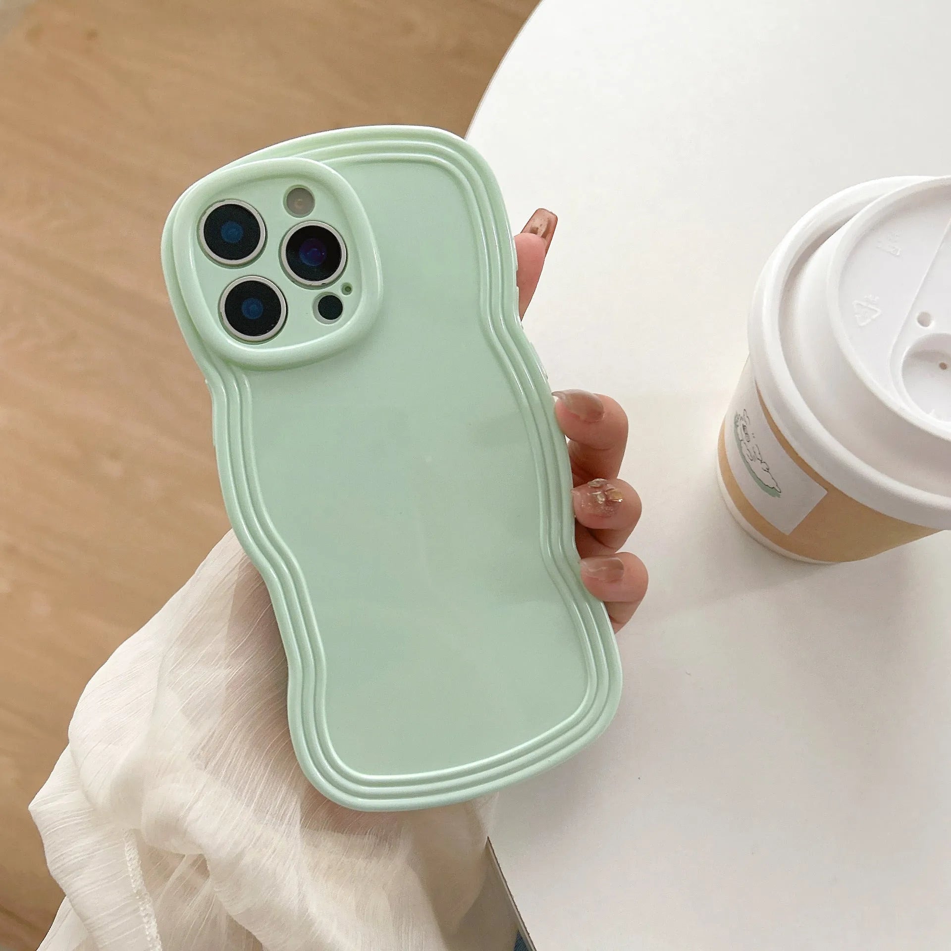 Cream candy colour wave design TPU case for iPhone on a white background.