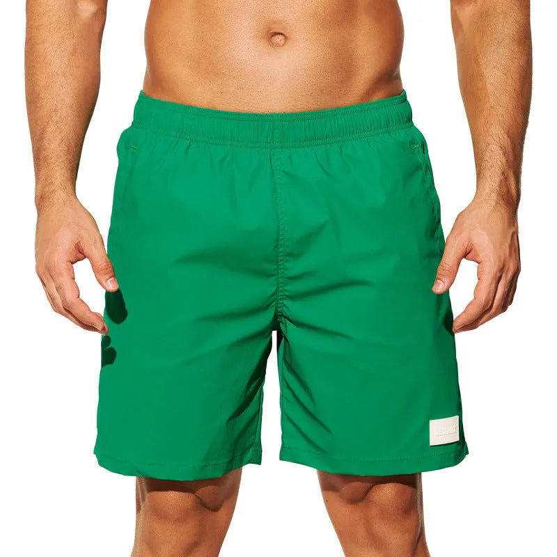 Men's quick-drying nylon beach shorts in blue with straight leg opening for swimming and sports