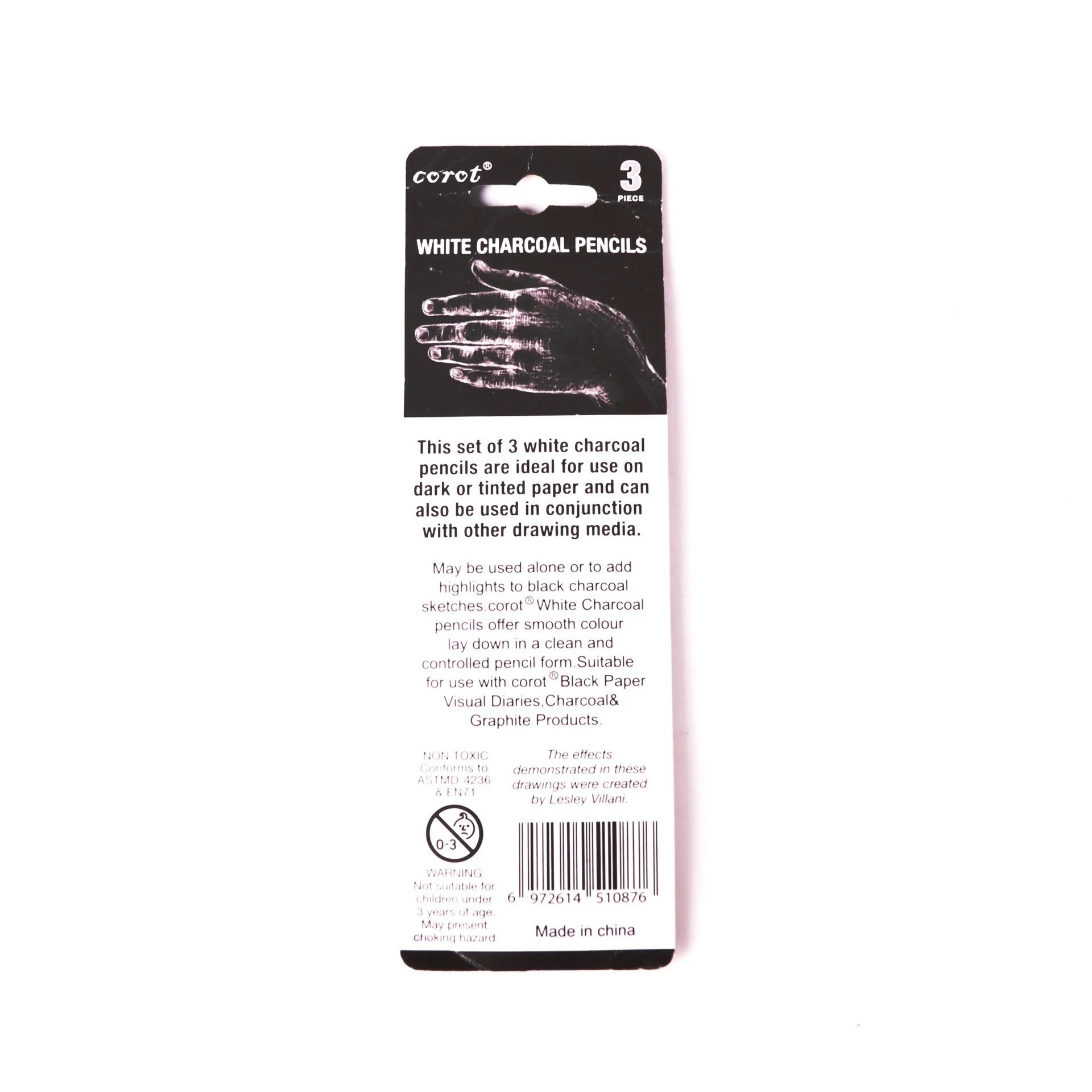 Set of three white charcoal drawing pencils with wooden casings.
