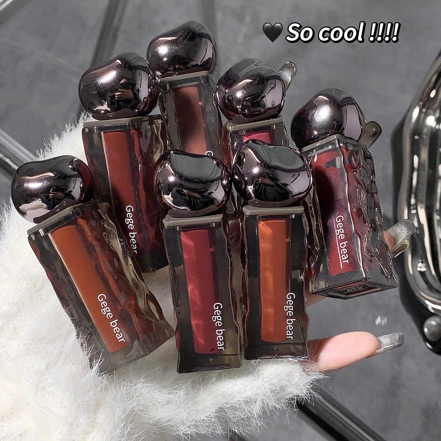 Glacier Lava Lip Lacquer tube in one of seven colour shades with a mirror gloss finish.