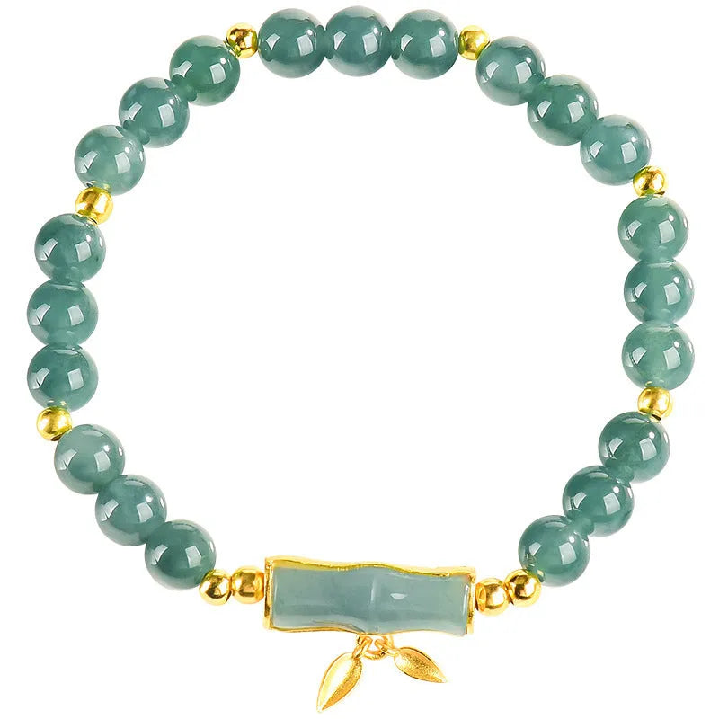 S925 silver bracelet with natural A cargo jade and blue round beads on a wrist.