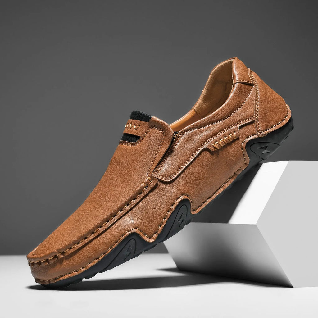 Men's leather slip-on casual shoes with round toe and flat rubber sole in four colour options