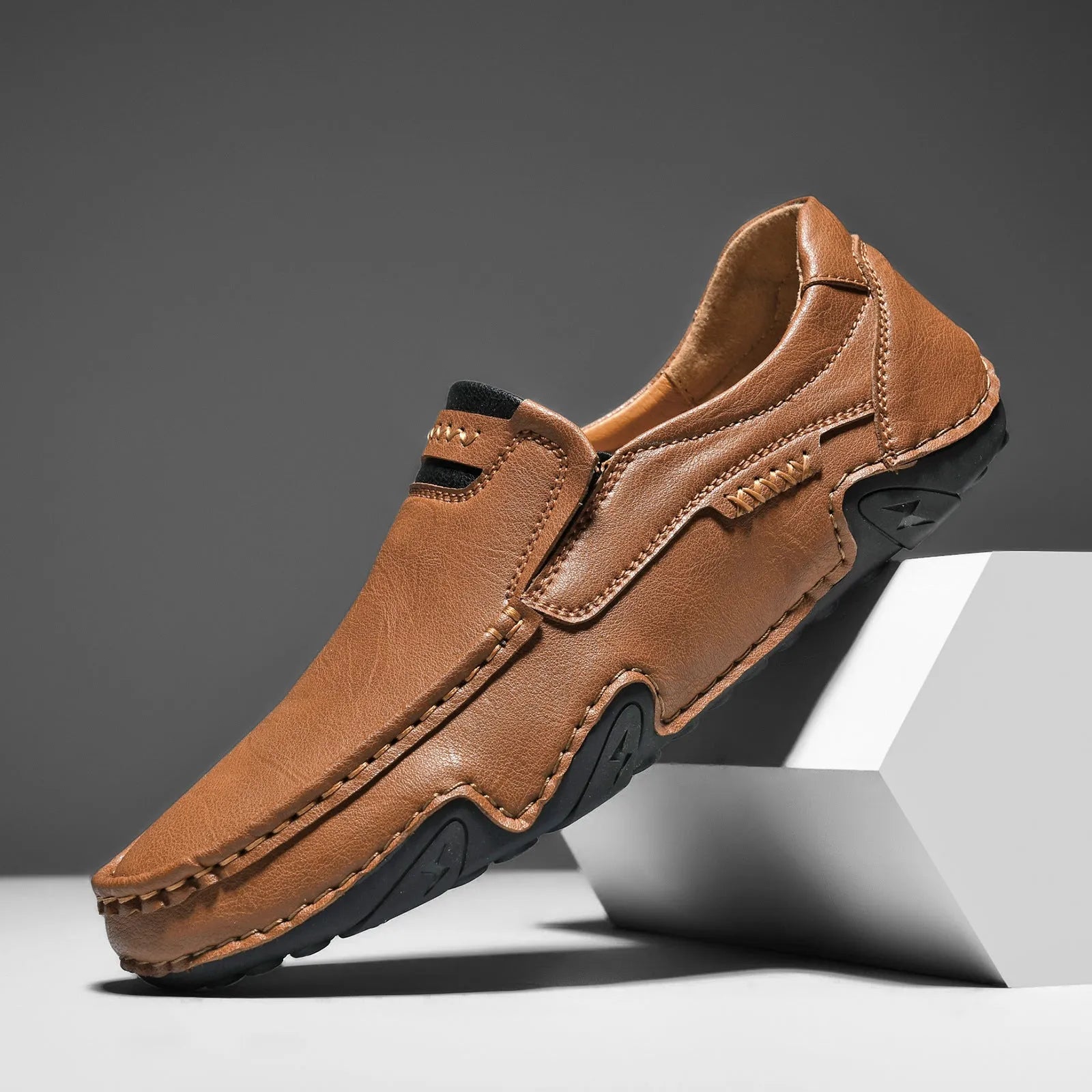 Men's leather slip-on casual shoes with round toe and flat rubber sole in four colour options