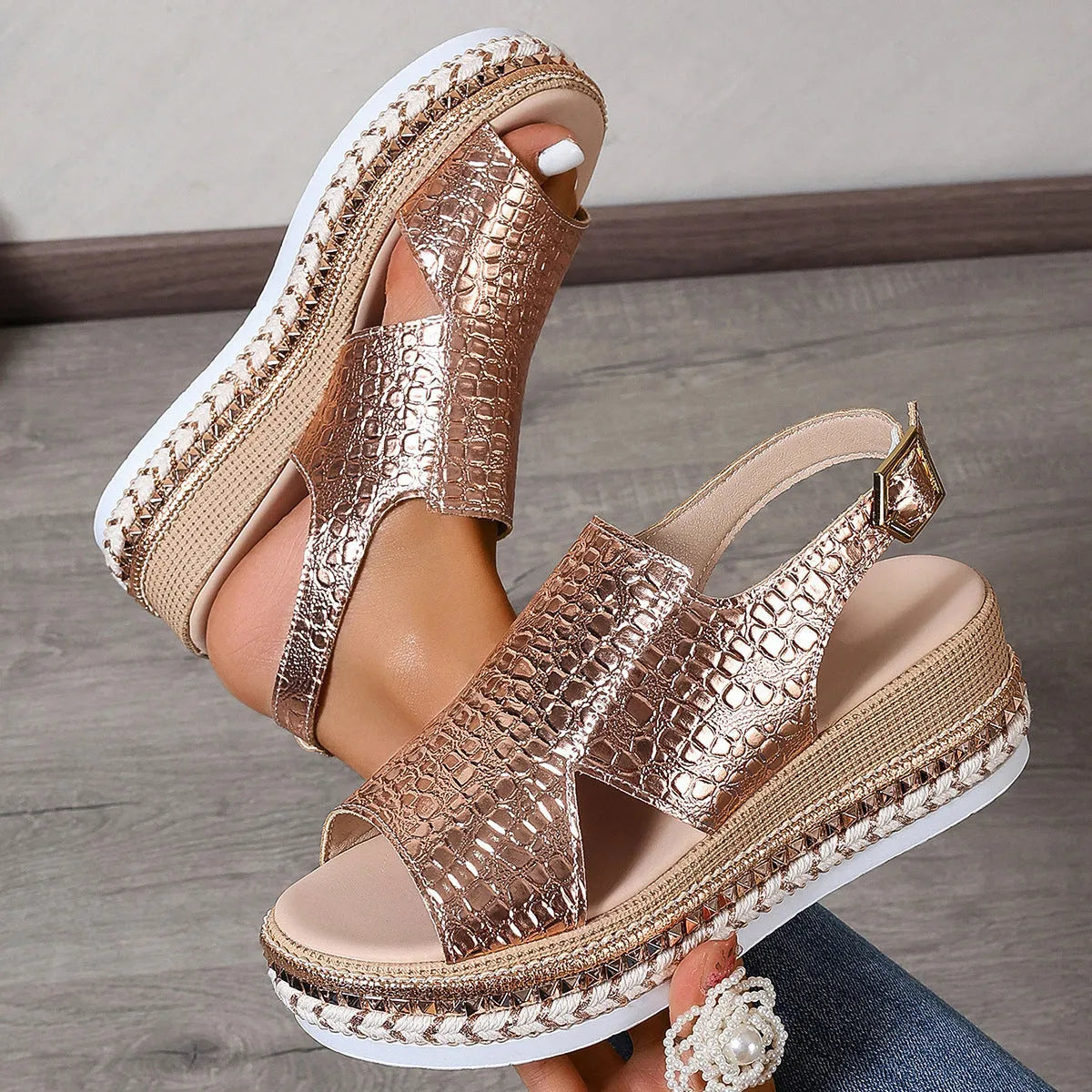 Gold roman sandals with round toe, ankle buckle, and hollow-out patterns on PU upper