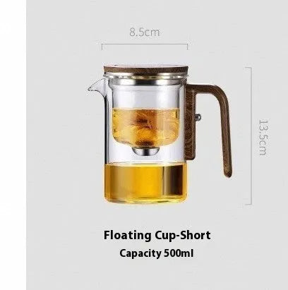 Glass teapot with wooden handle showing magnetic separation mechanism for loose leaf tea brewing