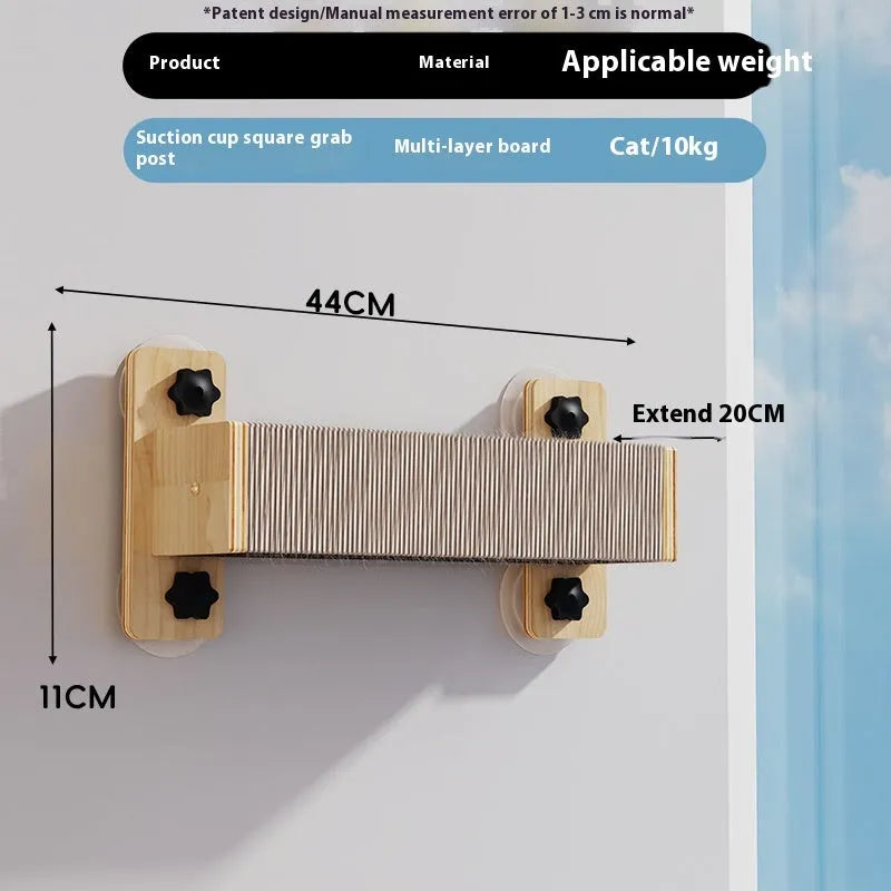Space capsule shaped cat scratching post with sisal rope, mounted on a window with suction cups.