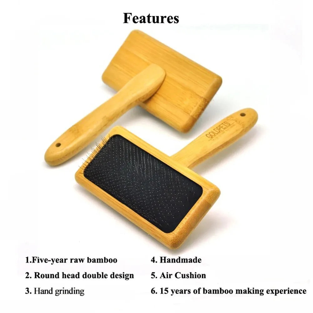 Goldpets bamboo handle pet slicker brush with stainless steel pins on wooden surface
