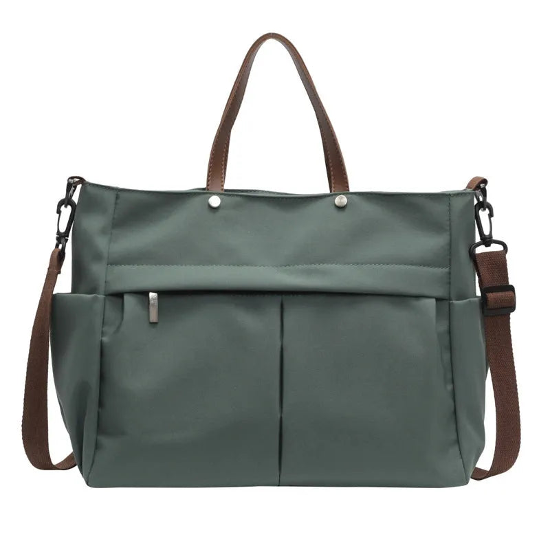 Nylon crossbody tote bag for women in black, shown with crossbody strap.