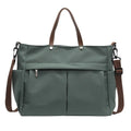 Nylon crossbody tote bag for women in black, shown with crossbody strap.