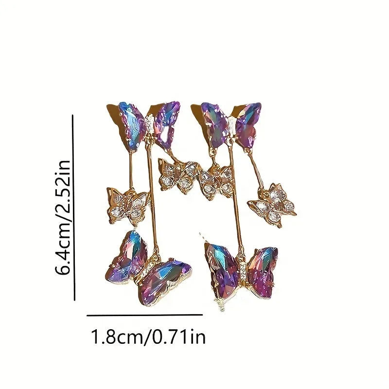A pair of silver needle blue purple butterfly tassel earrings with crystal flowers on an alloy base.