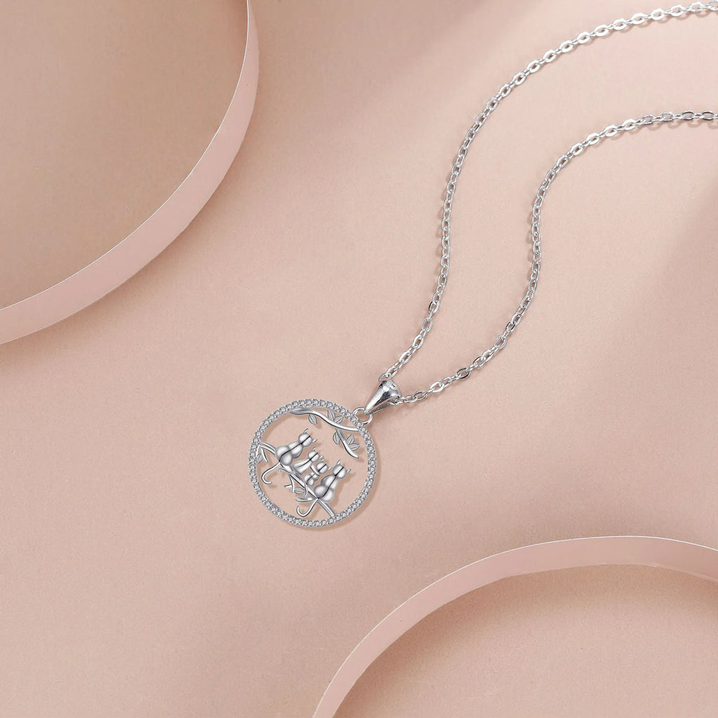 Women's copper necklace with four kitten pendant on cross chain, electroplated finish