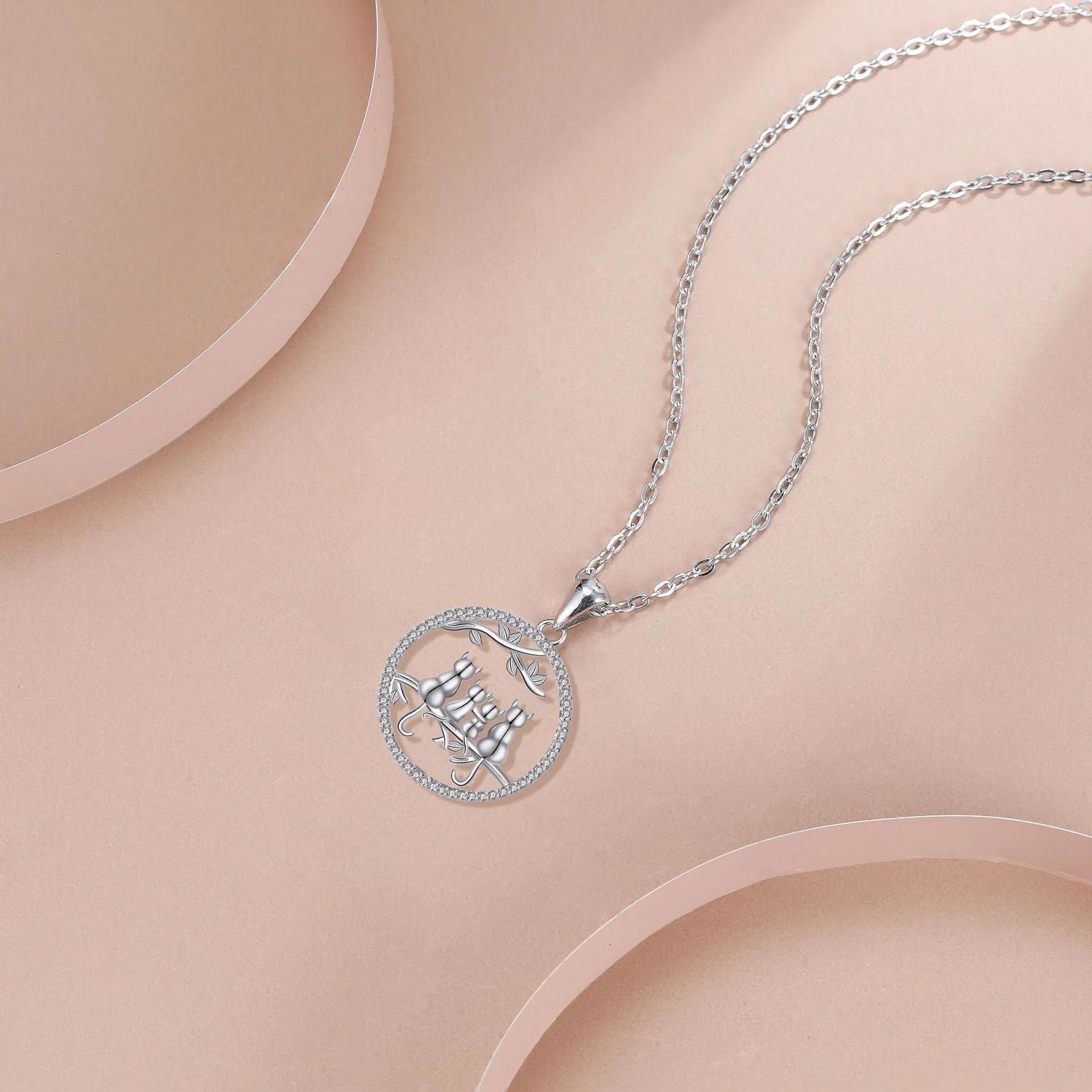 Women's copper necklace with four kitten pendant on cross chain, electroplated finish