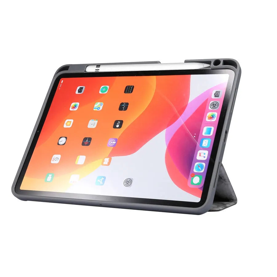 Dark grey marbling pattern iPad case folded in a stand position, showing the Apple Pencil slot.