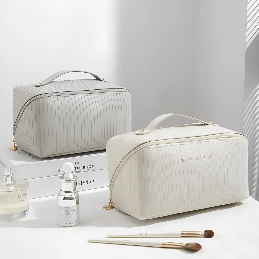 Vertical pattern cubic PU leather makeup bag in beige, shown open to display large capacity interior.