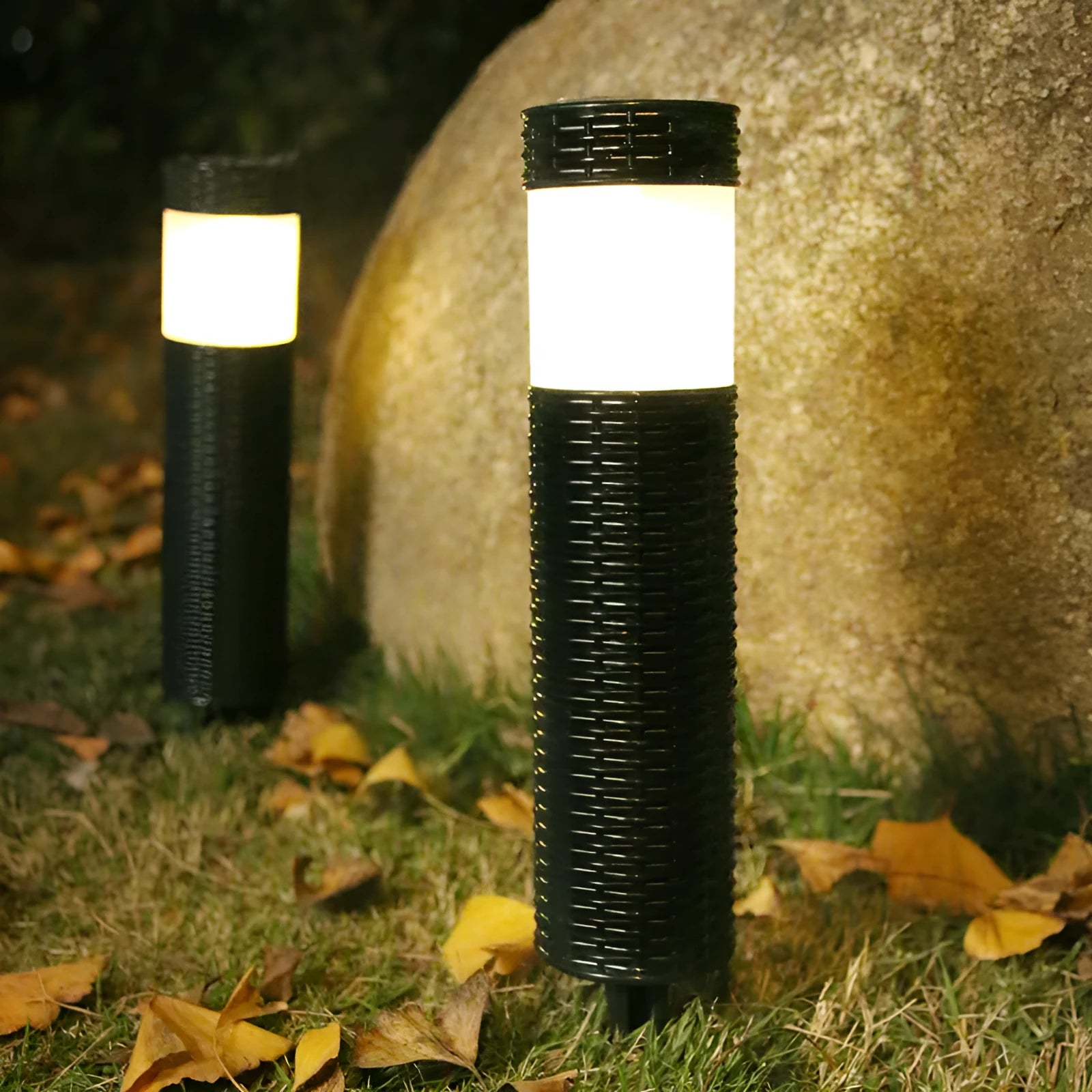 Outdoor garden light with abstract design and simulated flame effect for courtyard installation