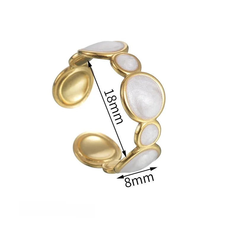 A geometric-shaped stainless steel ring with an adjustable opening on a plain background.