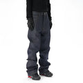 Man wearing dark blue loose straight-leg casual jeans.