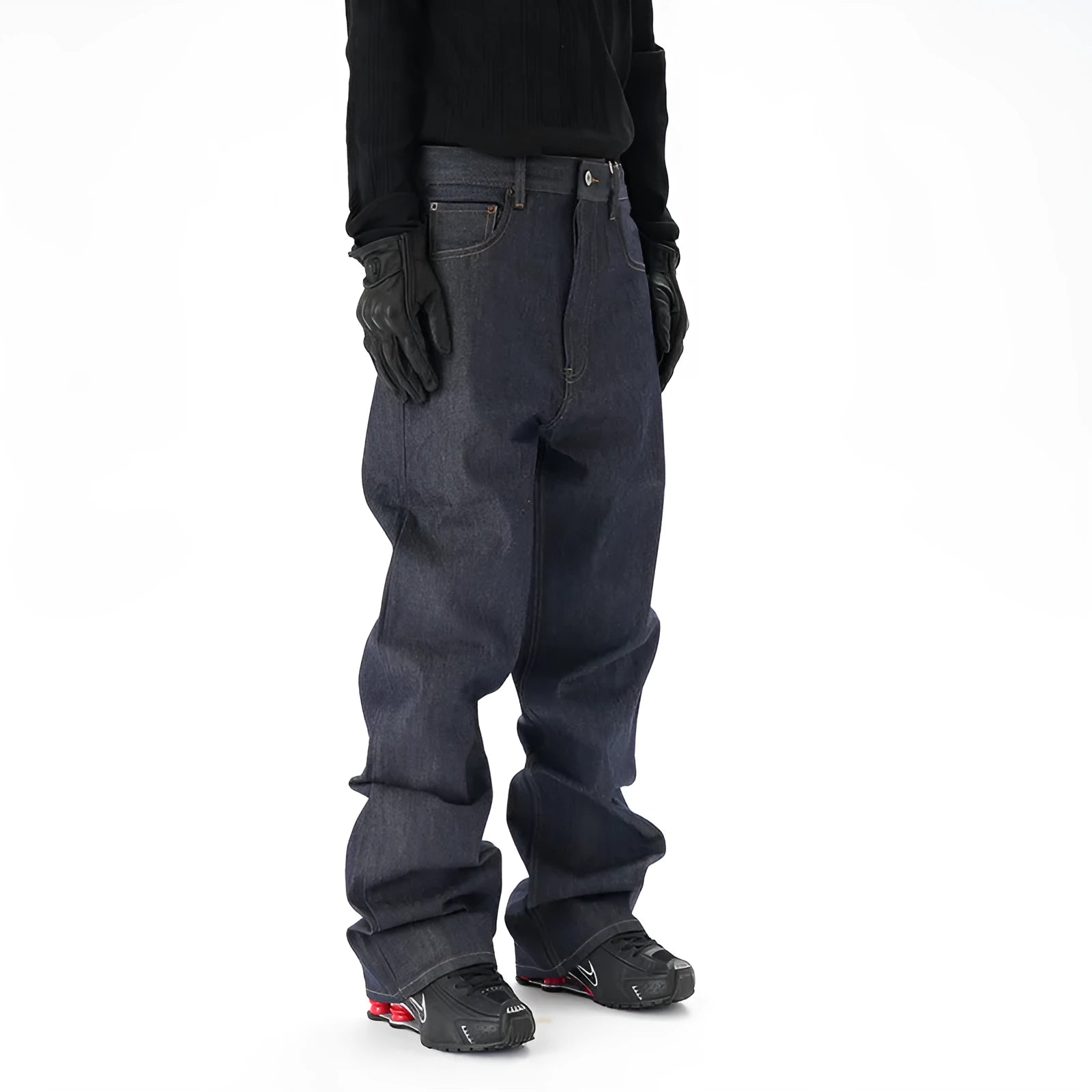 Man wearing dark blue loose straight-leg casual jeans.