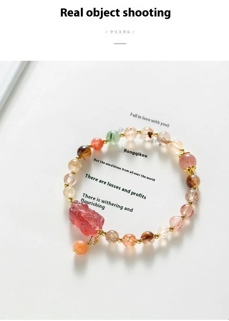 Women's strawberry quartz crystal bracelet with copper construction and pearl detailing in Chinese style design.