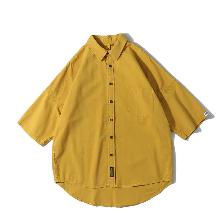 Men's loose fit Japanese cardigan shirt in a solid colour, shown in a summer setting.