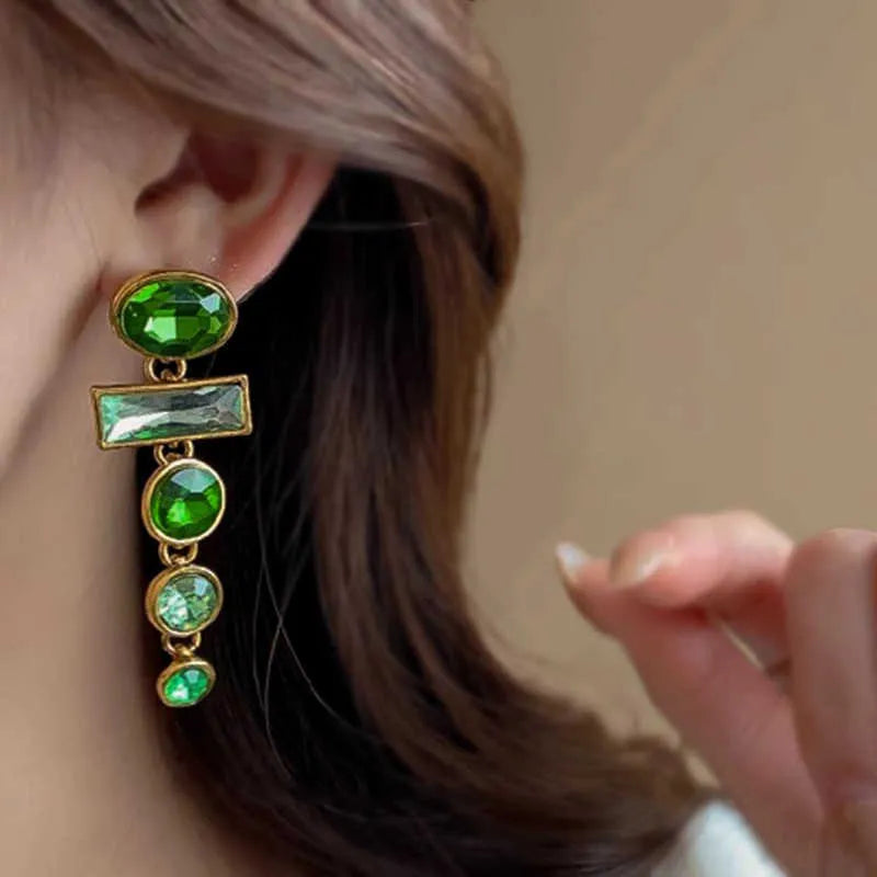 A pair of geometric green gradient alloy earrings with tassel design and inlaid zircon stones.