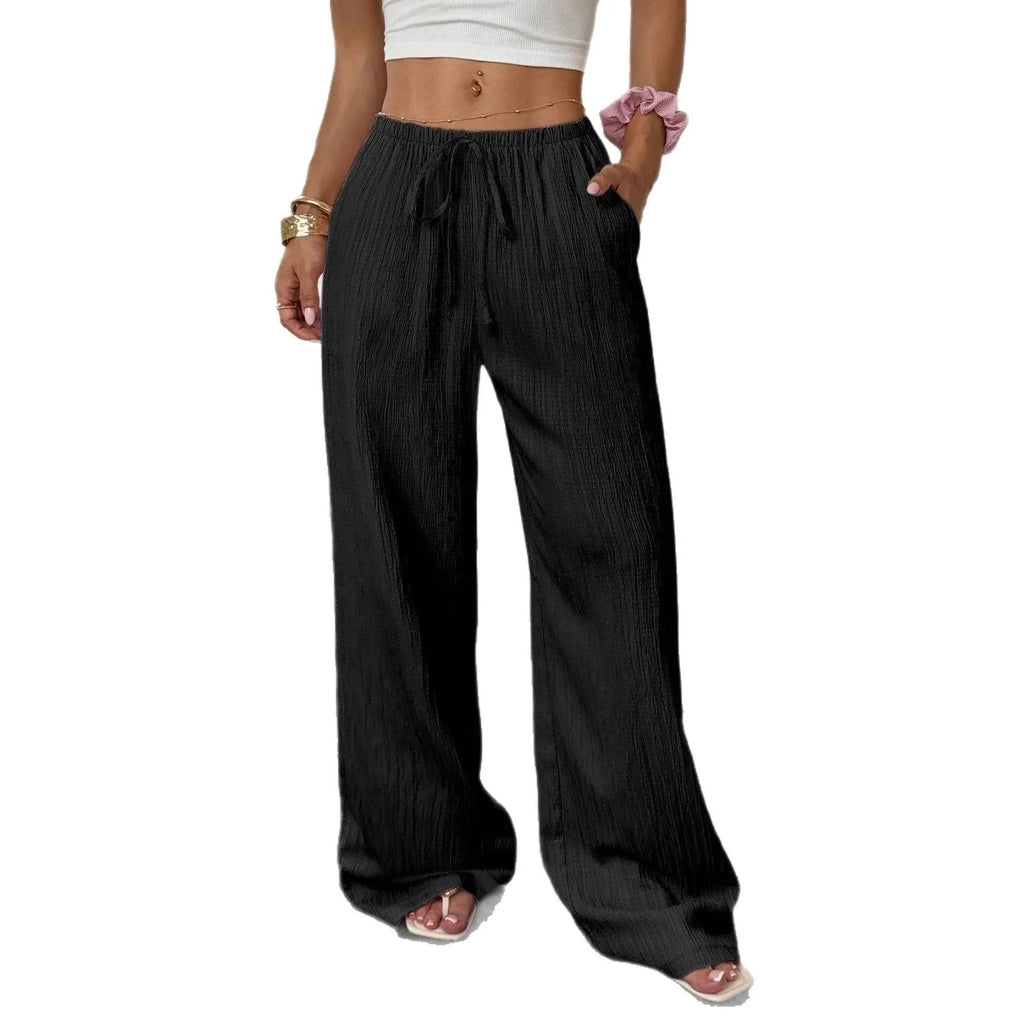 Women's black wide-leg trousers with lace-up waist detailing and mid-rise fit