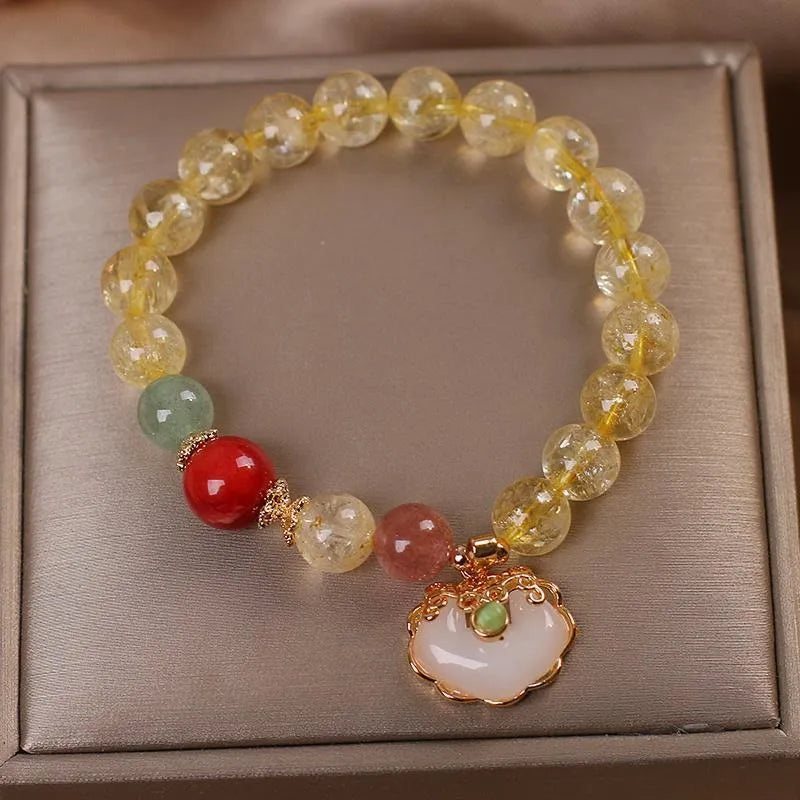 Women's citrine jade ruyi pendant bracelet with yellow crystal detail on alloy metal