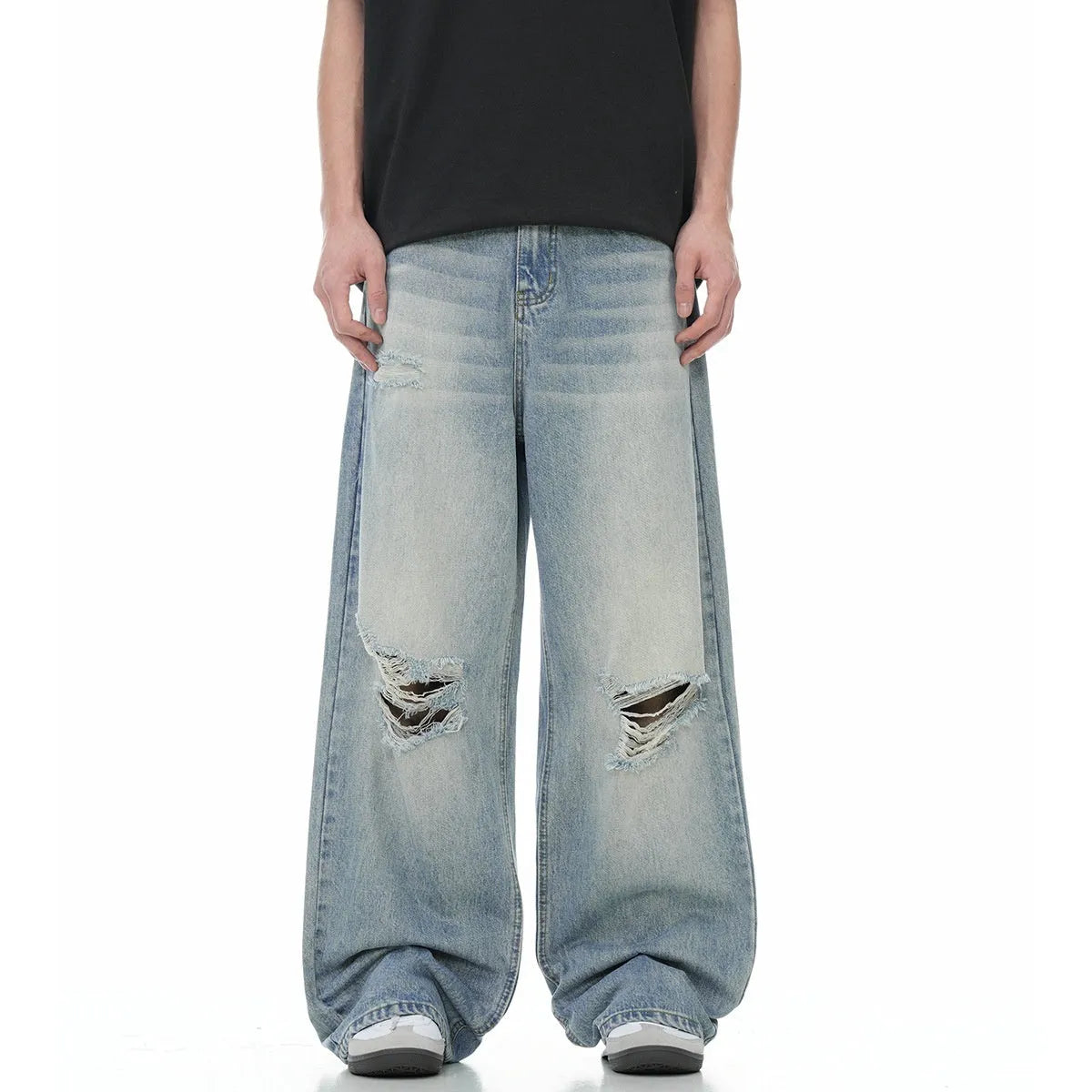 Man wearing blue retro-style distressed straight-leg cotton blend jeans.