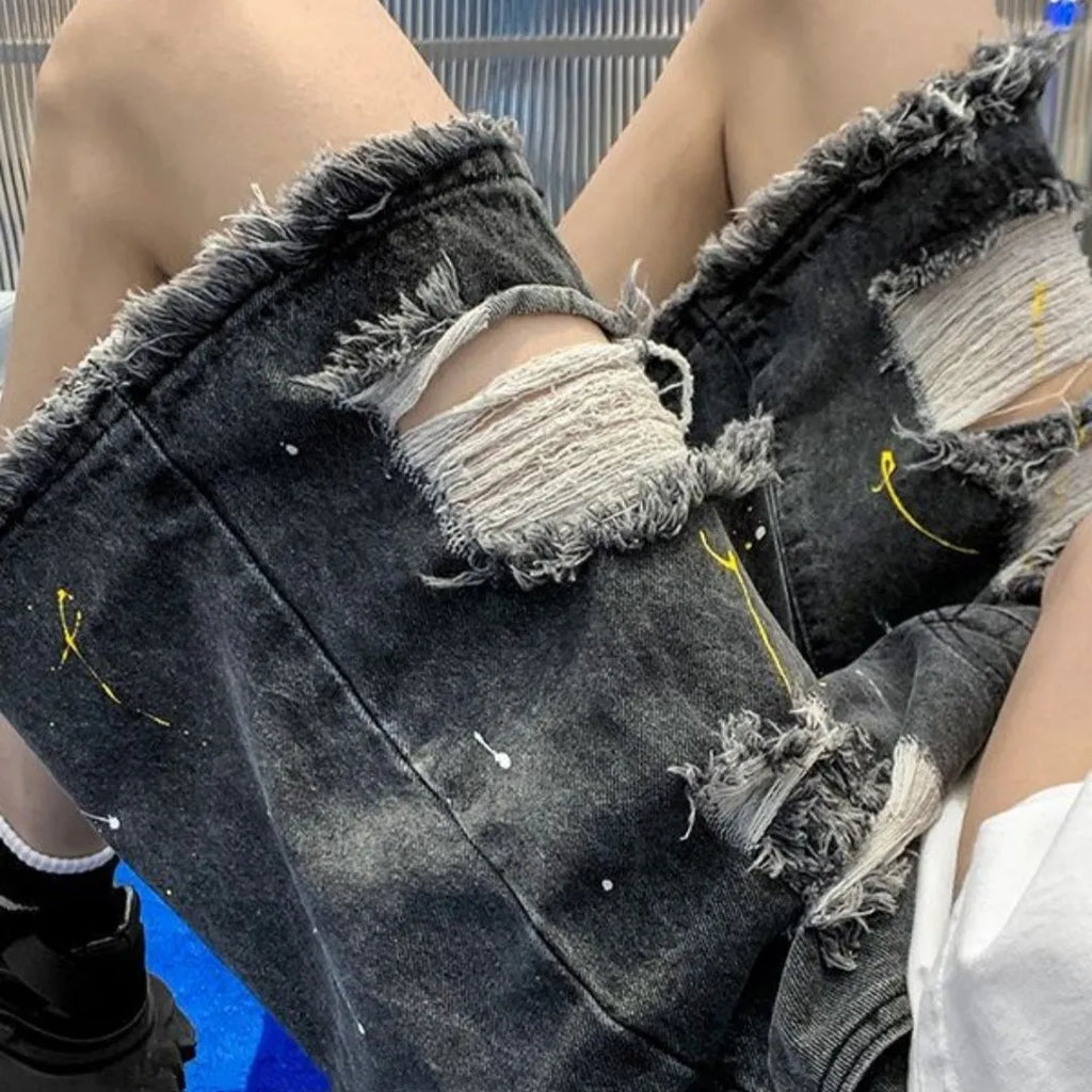 Men's black denim shorts with water-washed hole design and loose street style fit