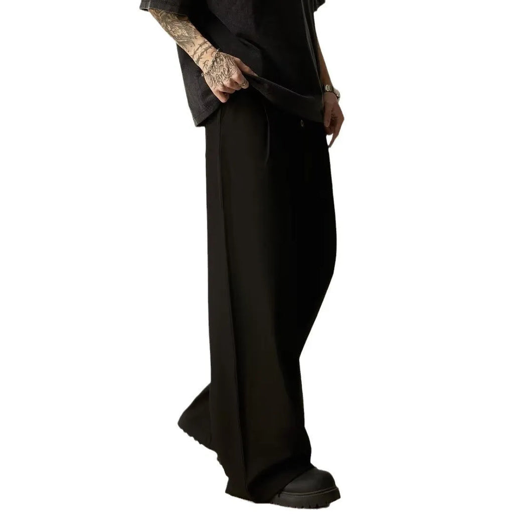 Men's solid colour wide-leg trousers with elastic waistband in black and brown options