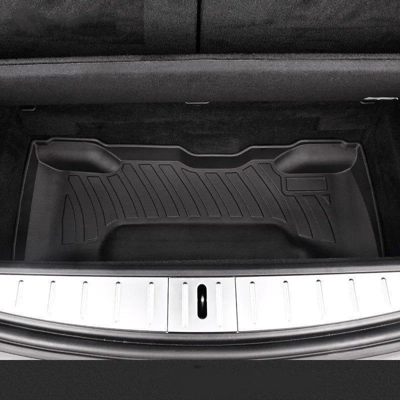 Custom rubber floor mats for Tesla cars, showing TPE footrest section and model-specific contours.