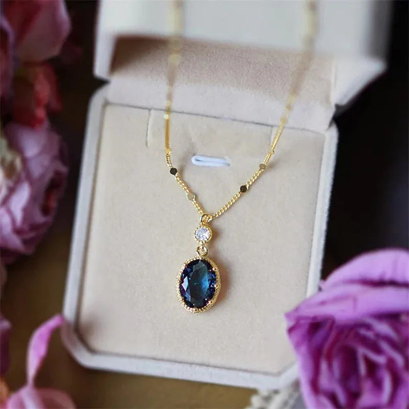 Gold geometric pendant on a French retro style copper chain necklace.