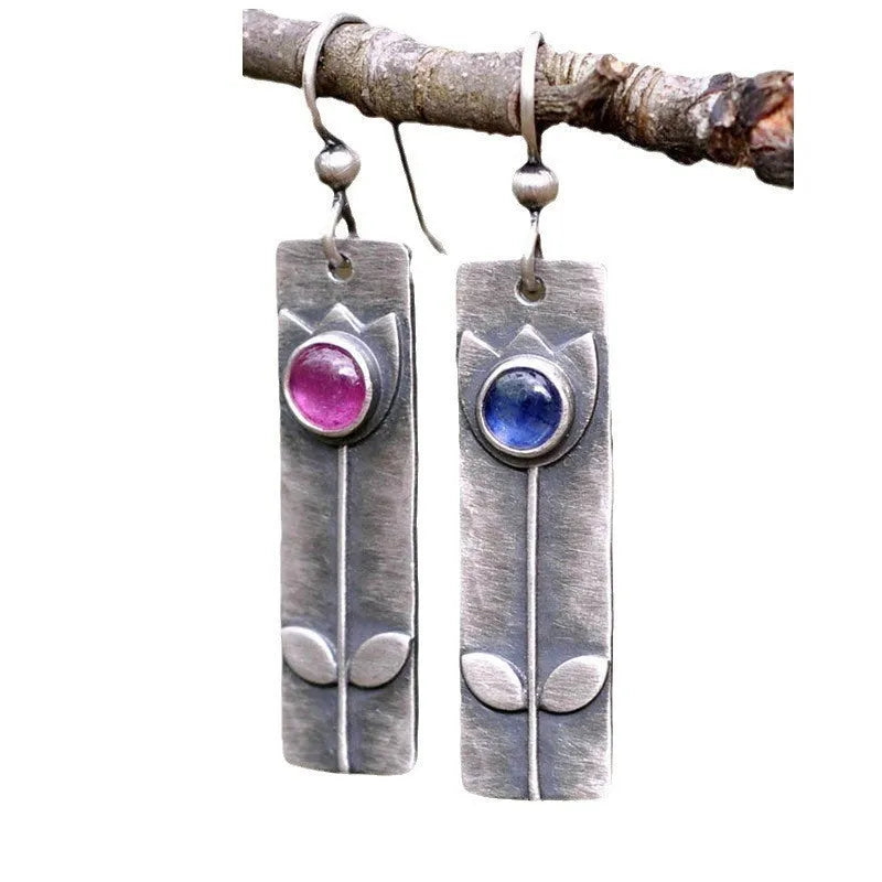Antique finish red sapphire geometric earrings with ellipse elements and electroplated metal construction