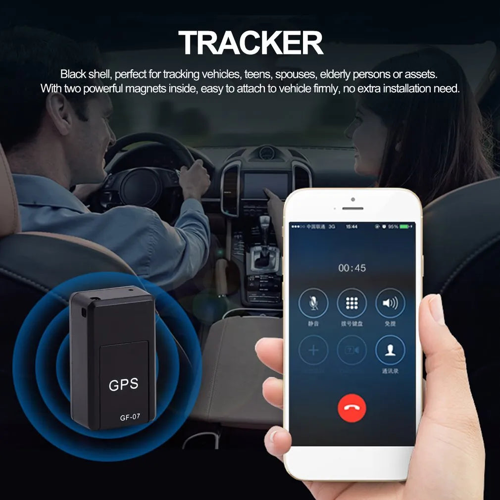 Small black plastic magnetic GPS car tracker device with USB cable.