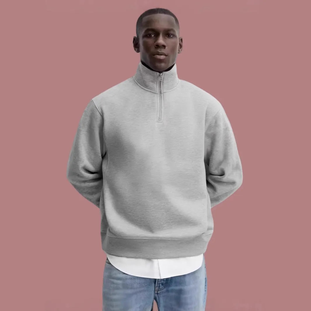 Grey cotton half zip stand collar sweater with long sleeves on mannequin