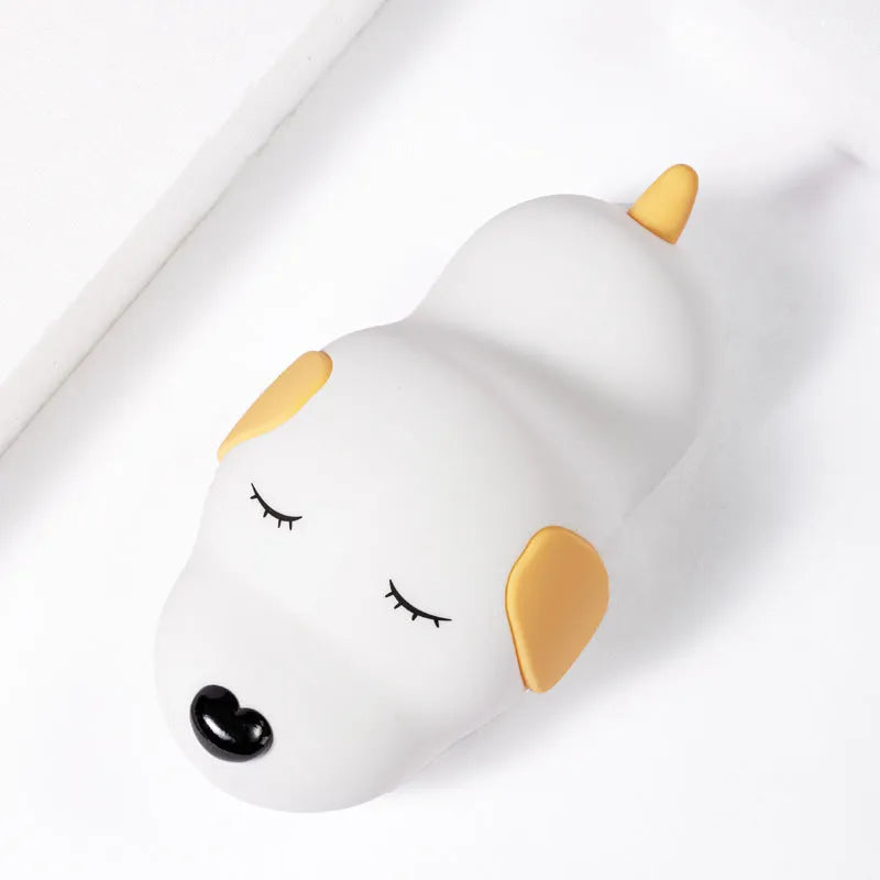 Cute two-colour cartoon dog silicone night lamp with USB cable for power.
