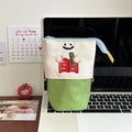 Brown collapsible Oxford fabric pencil case with zip, shown next to green version, measuring 17 by 14 cm.