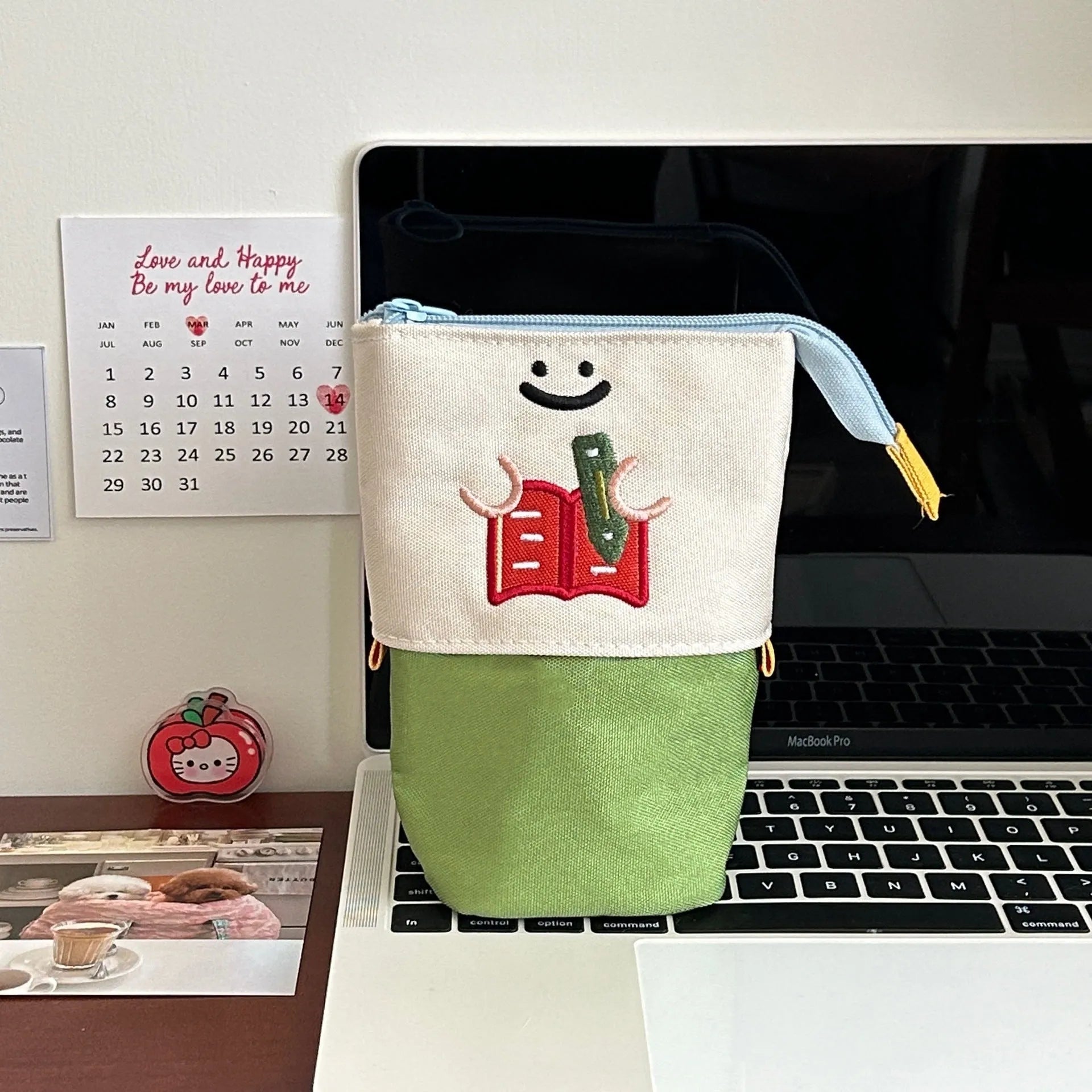Brown collapsible Oxford fabric pencil case with zip, shown next to green version, measuring 17 by 14 cm.