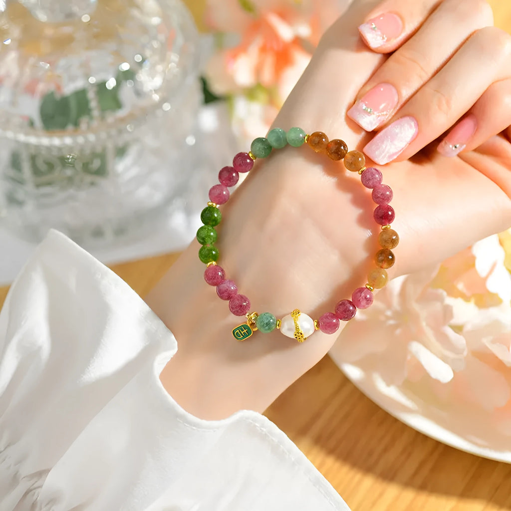 Geometric chalcedony bracelet with 6.5mm beads and natural crystal construction