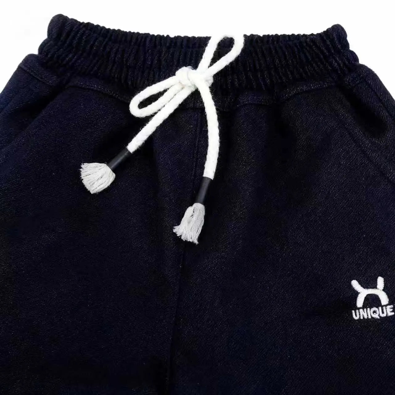 Children's trousers in black and blue with drawstring waist and ribbed hem, sizes 22-26 for ages 3-7