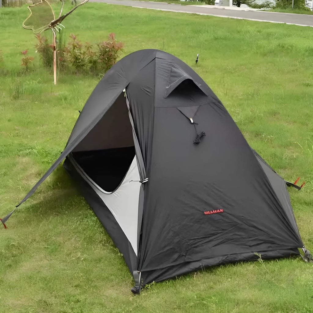 Single person camping tent with aluminium poles shown in black colour with waterproof outer layer and mesh ventilation panels