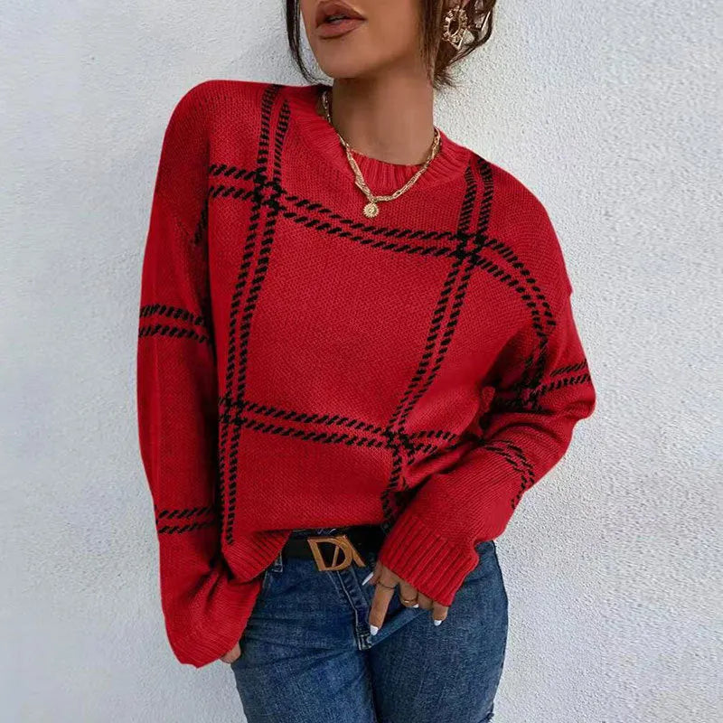 Women's loose fit crew neck sweater in a colour-block plaid pattern with apricot, black, beige, red, and green stripes.