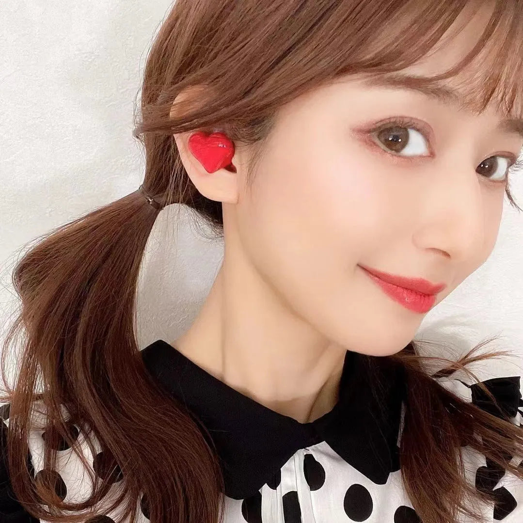 Heart-shaped wireless Bluetooth headphones in Chinese red or girl pink colours with in-ear design
