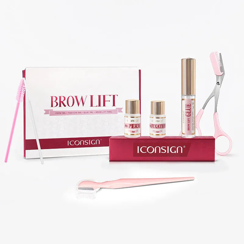 Pink eyebrow quick ironing tool inside a complete eyebrow perm suit set for home grooming.