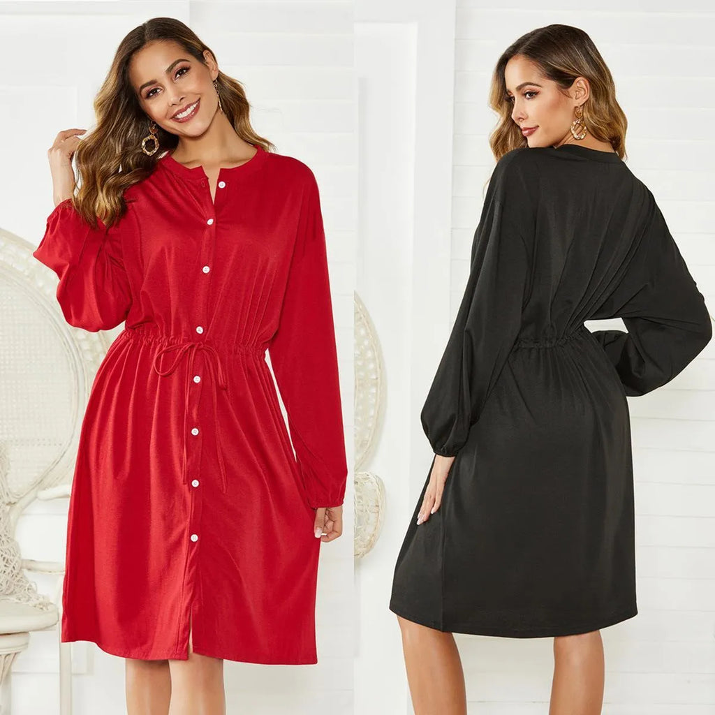 Women's black A-line dress with long sleeves, elastic waist, and a cinching belt.