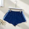 Men's navy blue high-waist nylon sports shorts laid flat, showing casual style and micro-elastic fabric.