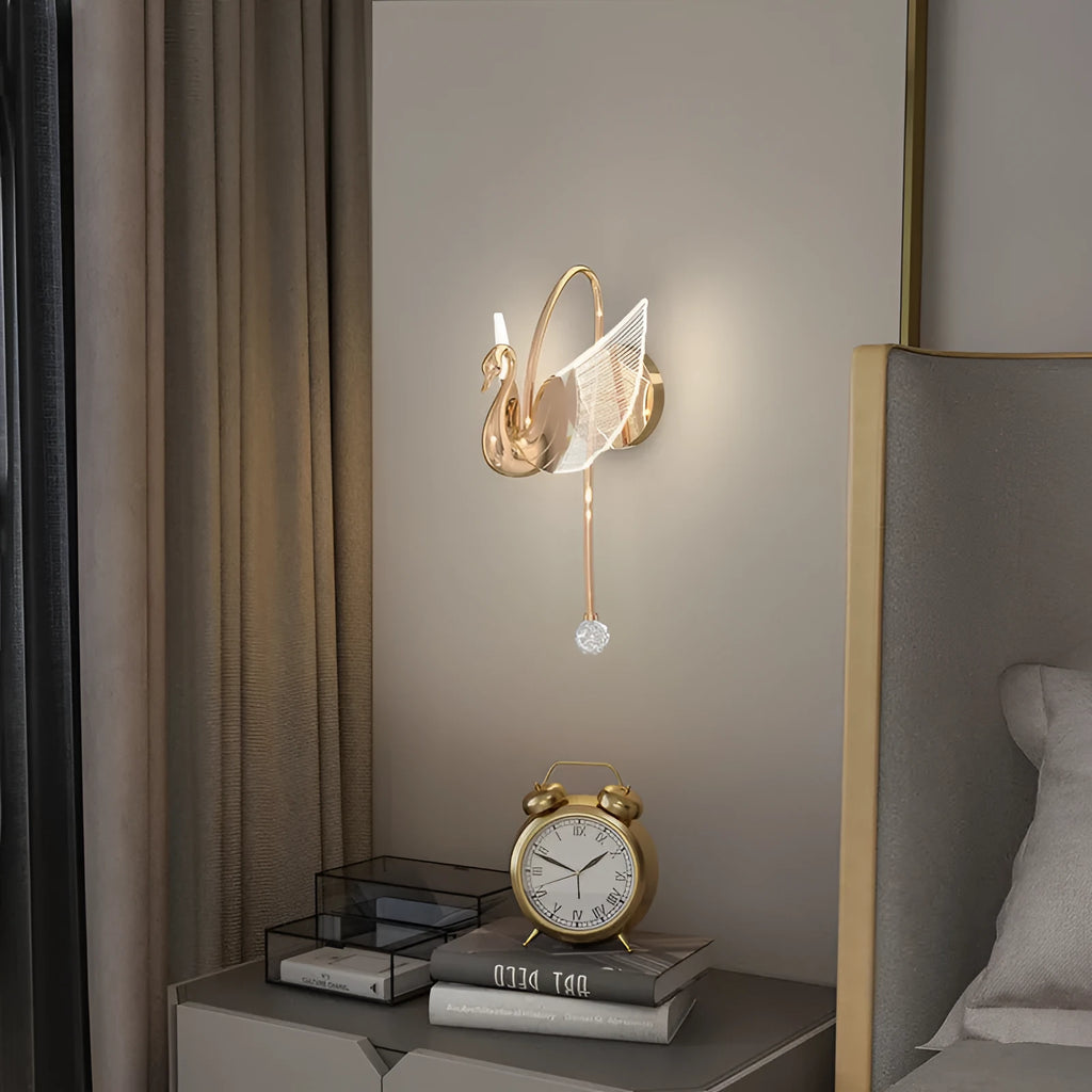 Modern gold swan-shaped wall lamp with acrylic shade and dimmable LED light.